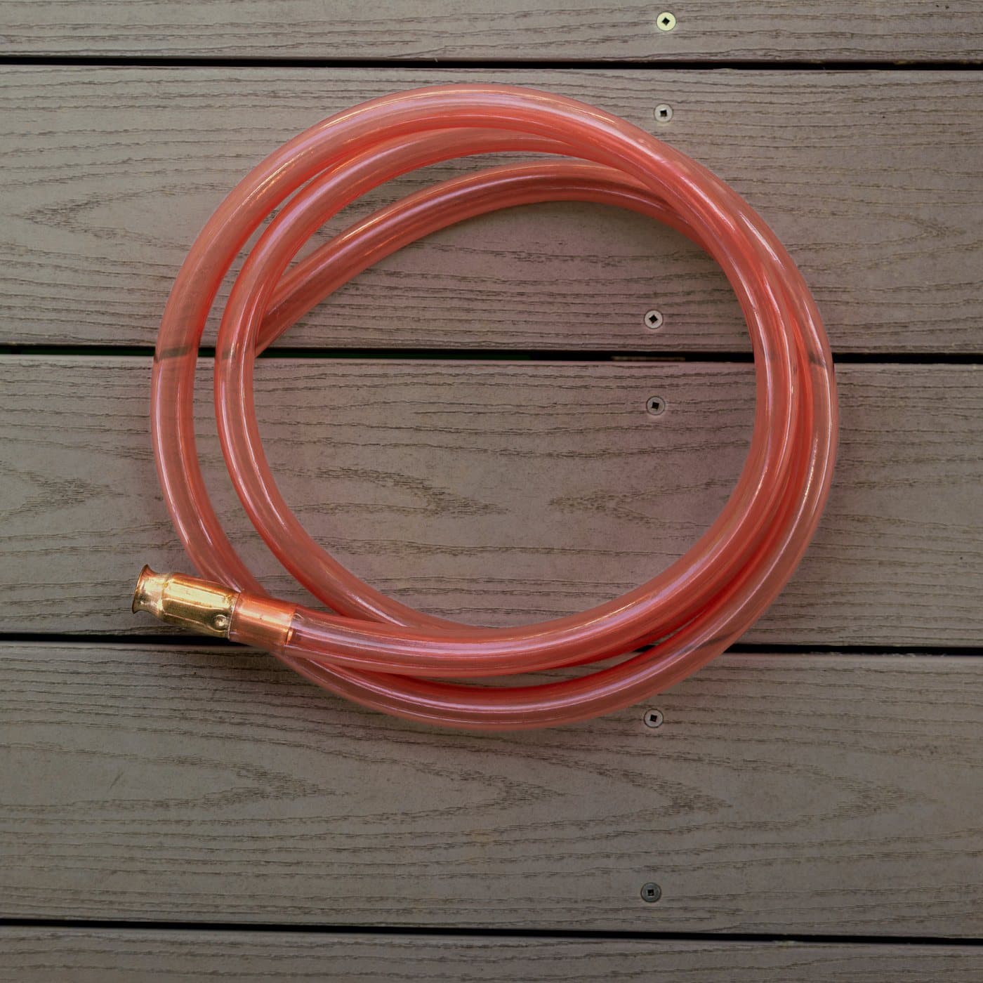 FlowPro — ¾" ID × 8' Self-Priming Siphon coiled on a dock